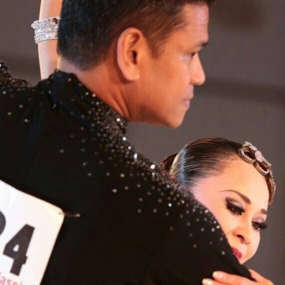 Ballroom competition close-up featuring Dance Alday performance